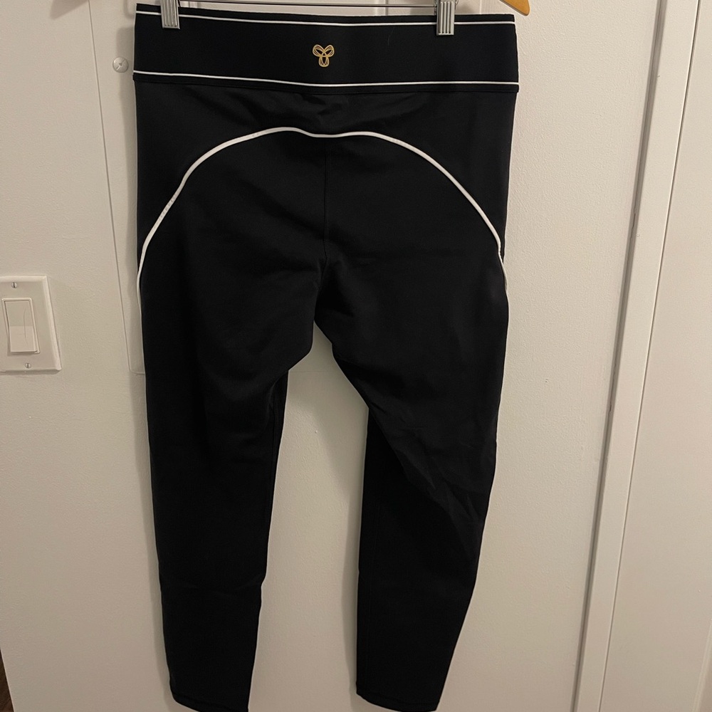 Aritzia Black Leggings with White Piping and Gold Logo